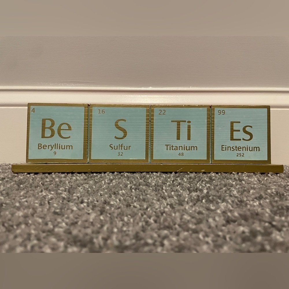 Besties wood sign.